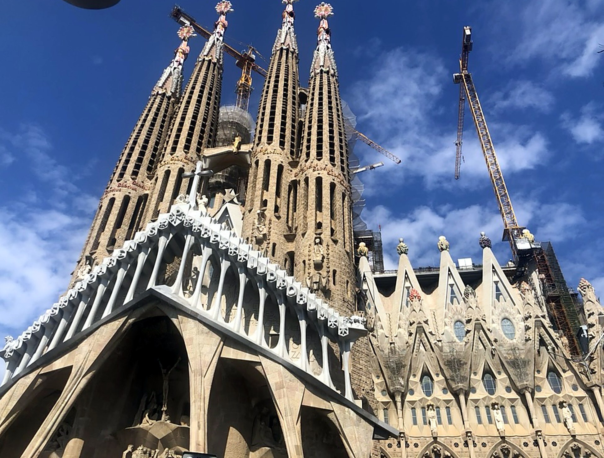 The Sagrada Familia basilica in Barcelona under a blue sky
